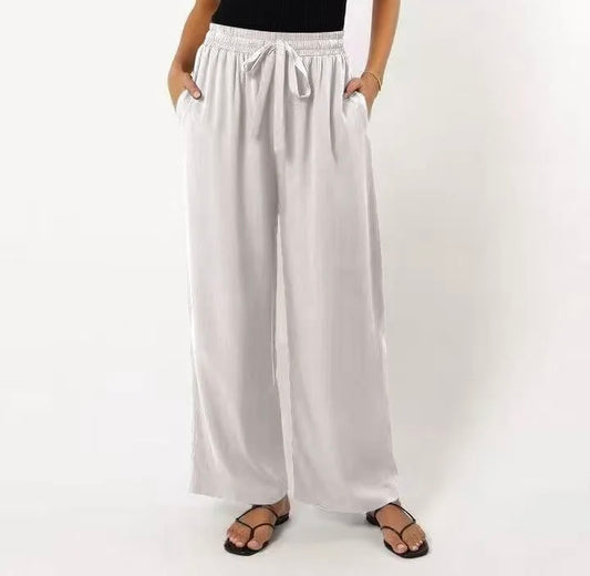 White wide-leg pants worn by a person on a white background